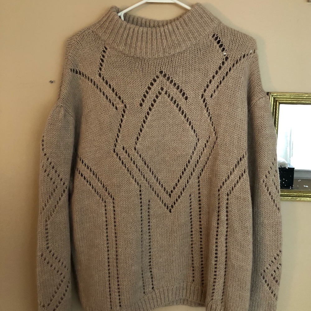 Very warm light pink/tan sweater with detailing